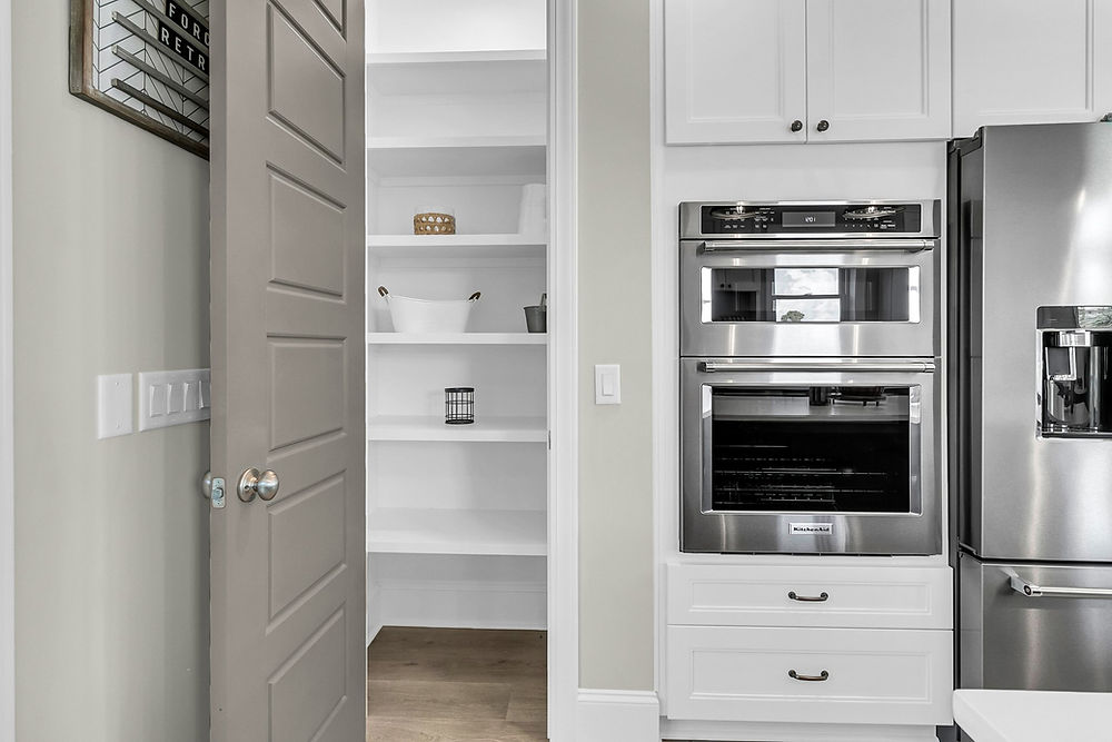 Kitchen with open pantry and double oven