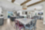 Modern open-plan dining room, kitchen, and living area
