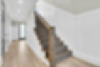 Bright hallway with wooden staircase