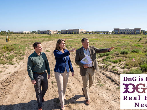 Commercial land brokers walking a vacant development site with a client