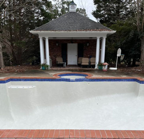 Swimming pool plaster and tile replacement renovation and concrete pool deck