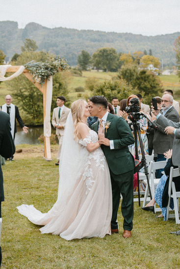 Bride and groom during an intimate outdoor wedding ceremony in finger lakes new york