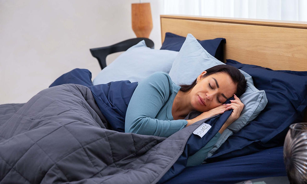 Woman sleeping comfortably under a weighted blanket