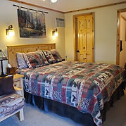 Spacious Idaho cabin rental with comfortable beds and outdoor decor.