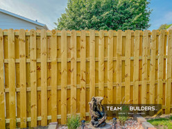 Custom cedar fence with 6' tall walking gate in Cedar Falls with viewing window
