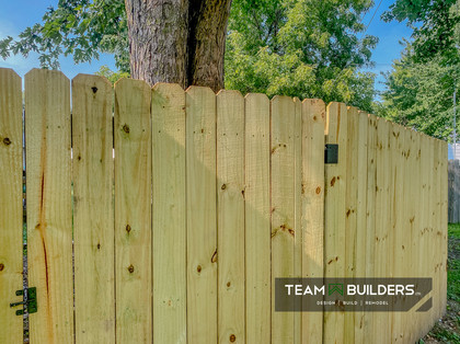 Close up of 6' tall and 4' wide treated privacy fence gate