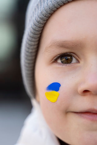 close-up-little-kid-with-ukrainian-flag-paint.jpg
