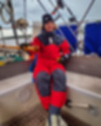 Captain Noble at the helm after some rough weather on Wabi Sabi