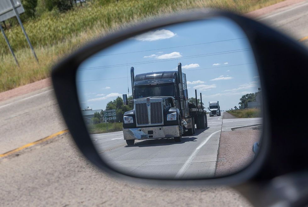 Trucks at the intersection of Highways 42 and 81, South Dakota.