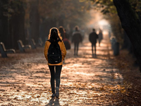 A solitary person walks forward, their back turned to the camera. The blur obscures the distance, symbolizing the invisible struggles and uncertainty of chronic illness — and the quiet strength it takes to keep going without being fully understood.