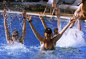 swimming pool, people smimming, blue water, ibiza holidays, happy people, pool party, people dancing and having good time inside swimmimg pool, ibiza jet apartments
