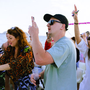 boat party in san antonio waters ibiza, house music events, happy people dancing and having a good time, ibiza events, blue sea, blue sky