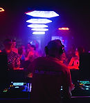 nightclub, eden ibiza, people dancing, dj decks, dj playing, people having a good time, light show, ibiza jolidays, ibiza events, house music events, ibiza party holidays, ibiza.playabout branded t-shirt on the dj back