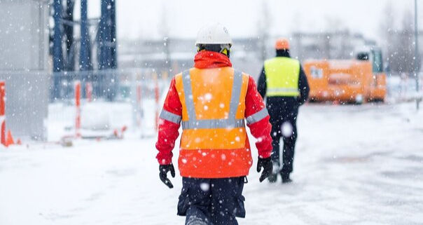 construction workers in the snow