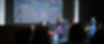 Adults leading church congregation in worship