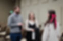 Adults smiling and talking at church