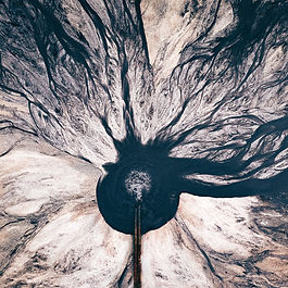 A dump into a wastewater reservoir in an industrial area. 
