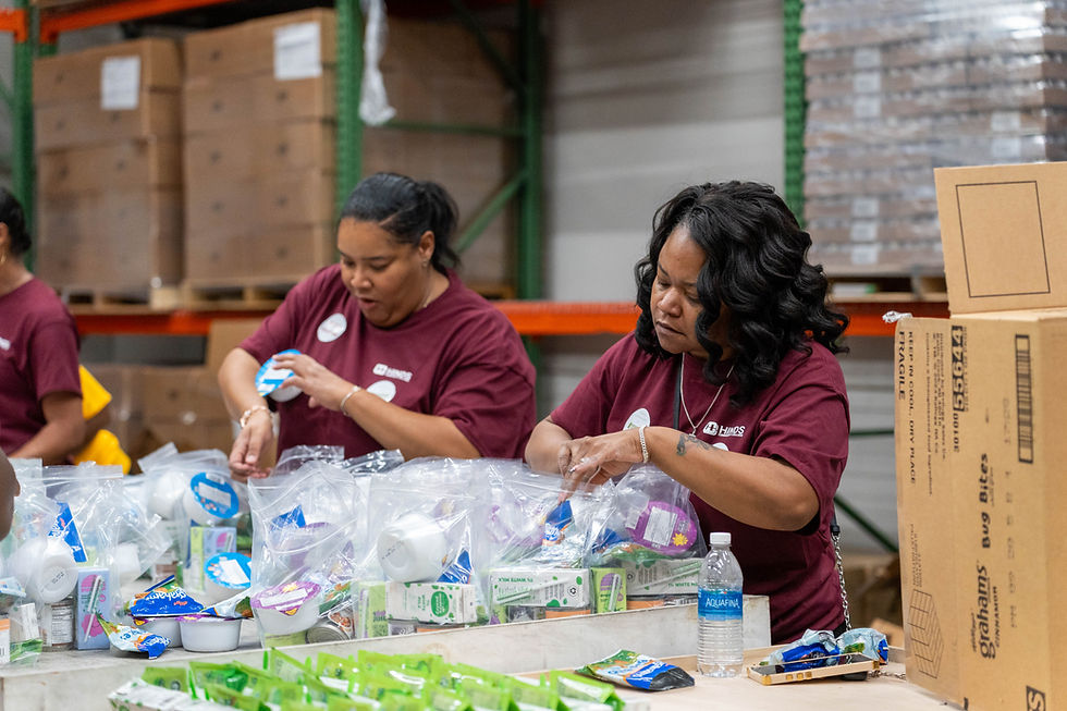 Volunteers at the Mississippi Food Network pack kits for the Backpack Program, ensuring students across the state have healthy meals to take home.