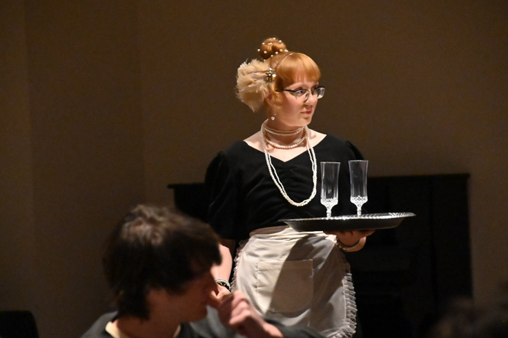 Anna McKenzie, playing role of the waitress Genevieve