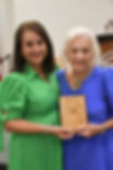 Chamber member Dixie Thornton presents Citizen of the Year award plaque to Sharon Langley.