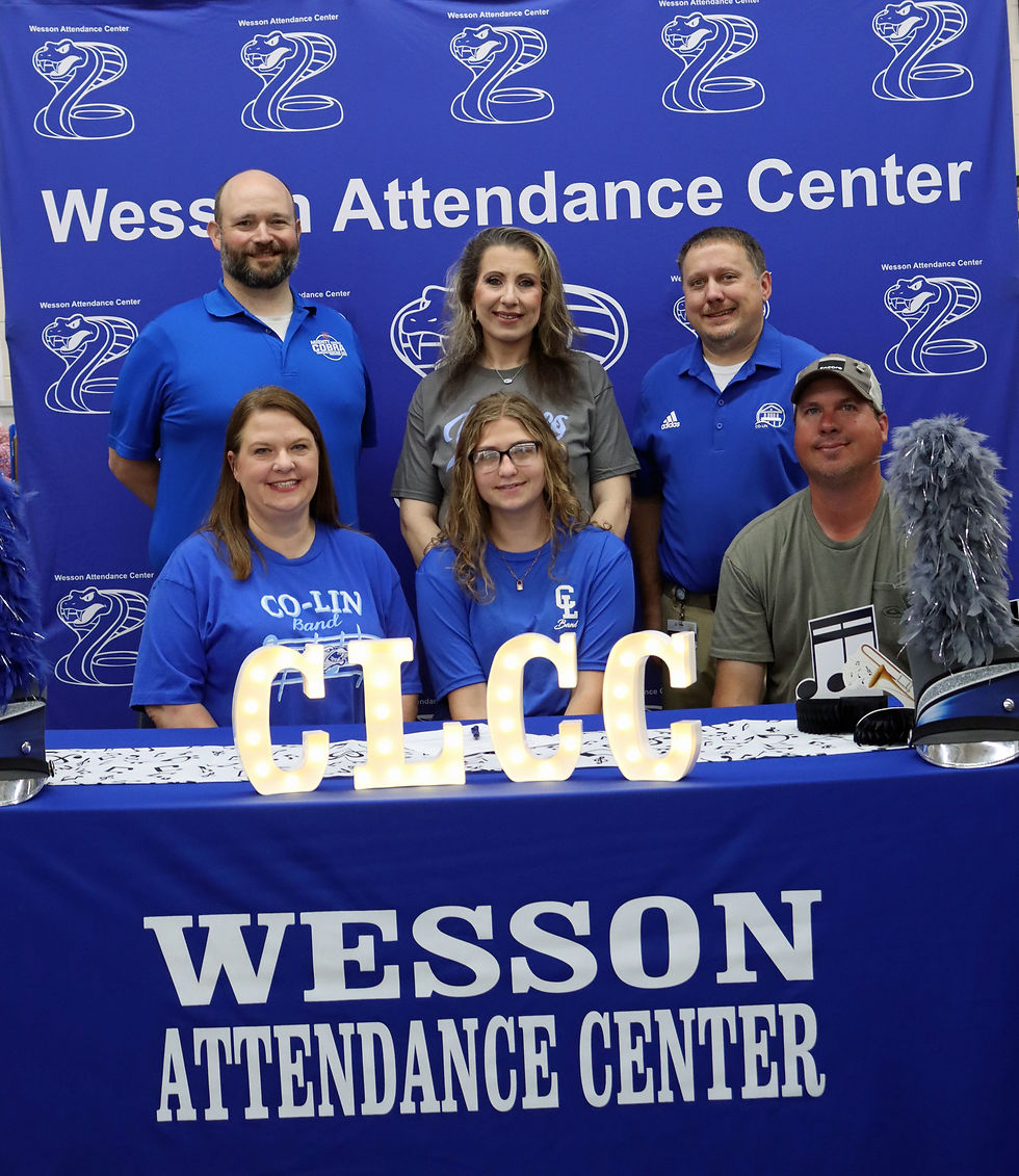 Madison Morris signed a scholarship with Co-Lin's Blue Wave Show Band to participate in color guard. Pictured with Madison are front (left to right): mom Melissa Morris, Madison Morris and dad Jeremy Morris; and back row: Wesson Band Director Andrew Bonner and Co-Lin Blue Wave Show Band Director Chad Austin.