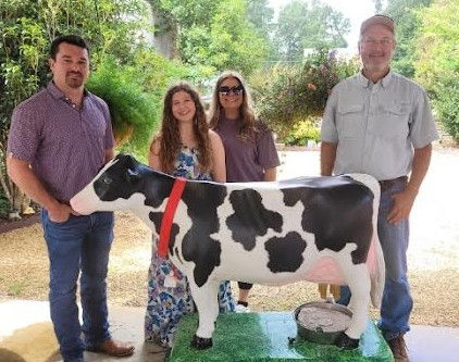 Copiah County Farm Bureau staff (left to right) are Austin Graham, Shelby Burge, Melissa Morgan with County Agricultural Extension Agent Shelby Bearden, along with Lilly Belle, a simulated cow.