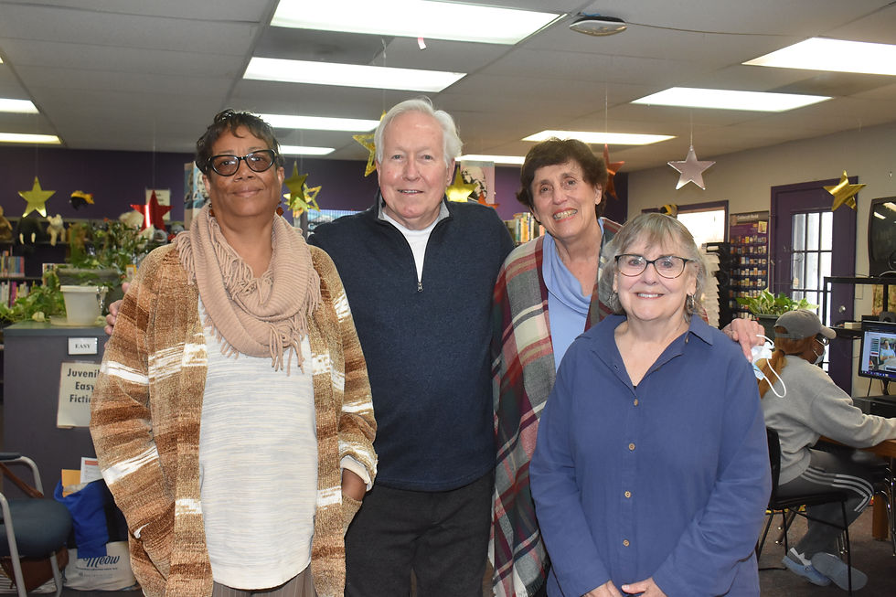 Community Outreach Ministry makes gifts to library