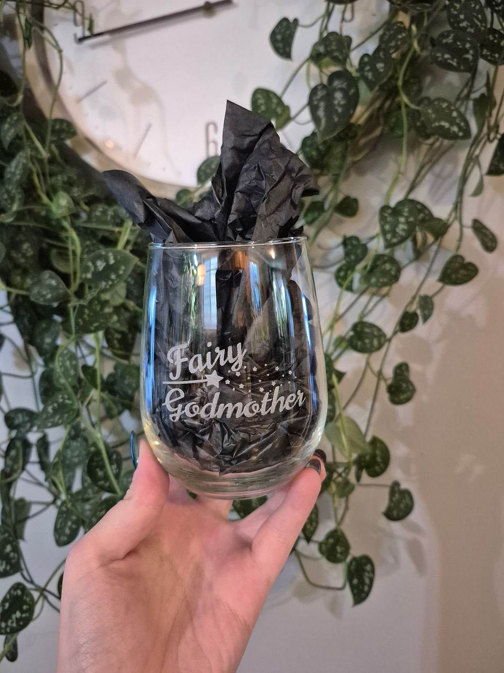Thumbnail: Hand holding stemless glass engraved 'Fairy Godmother'