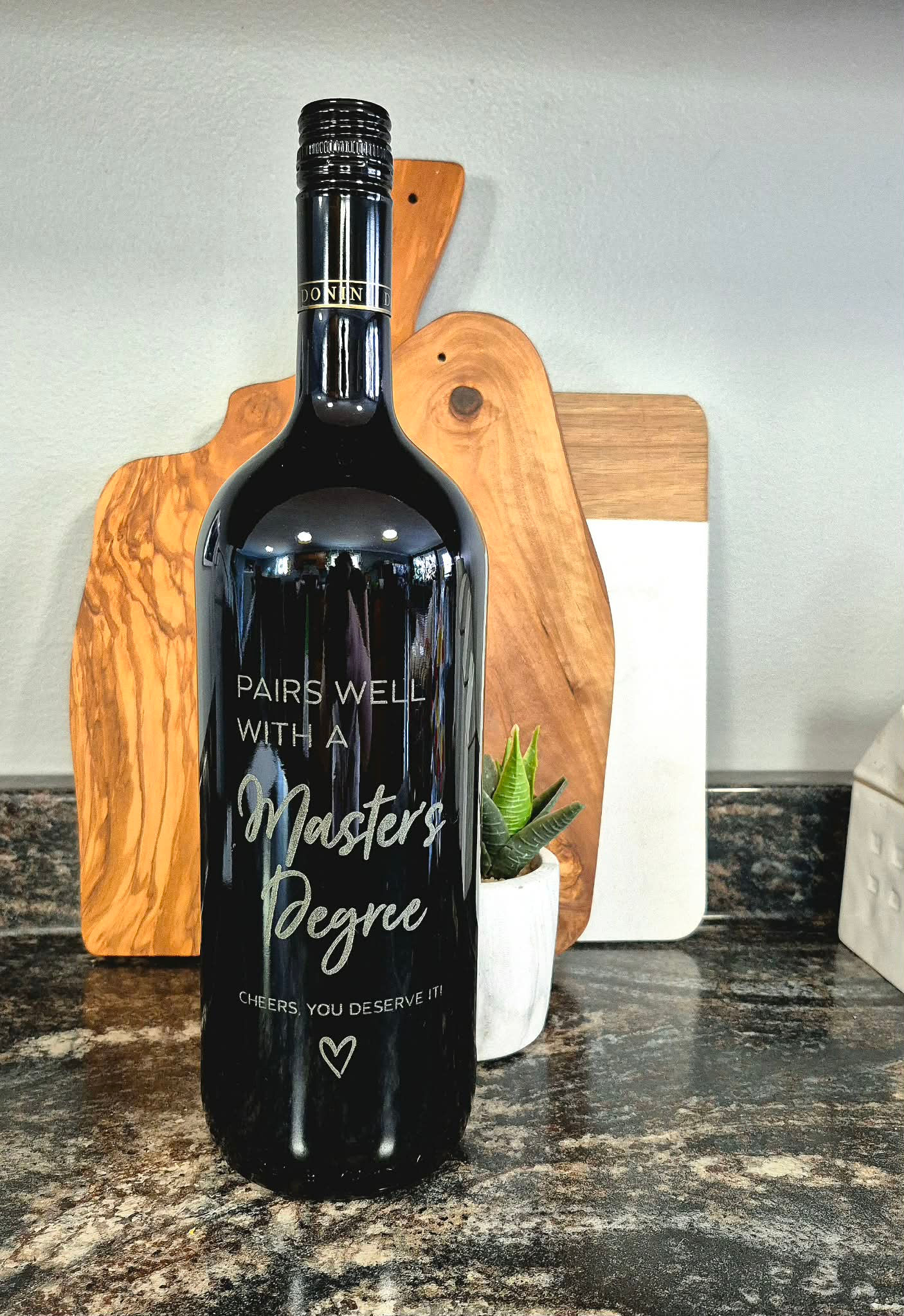 Bottle with 'Masters Degree. CONGRATS YOU DID IT!'