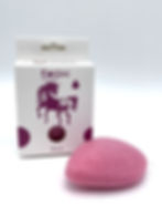 A pink Konjac sponge in front of a Konjac sponge box