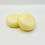 Thumbnail: Two round shaped conditioner bars that are a pale yellow colour