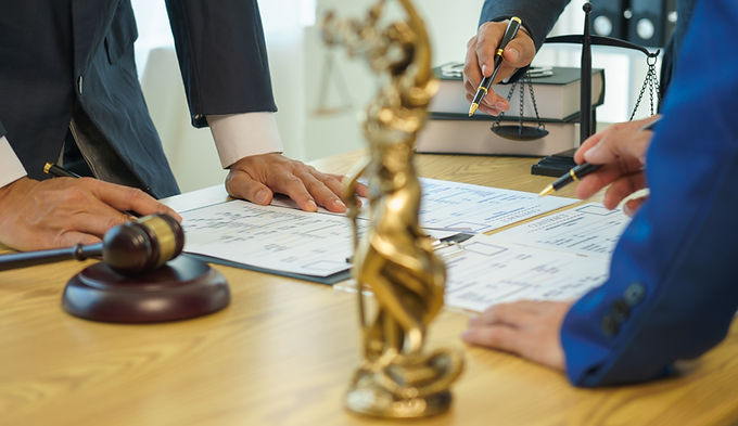 A team of lawyers shares knowledge and discusses difficult cases