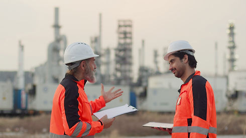 Two industrial engineers strategizing on site