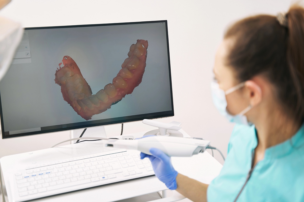 Dentist analyzing 3D scan of patient teeth in clinic 

