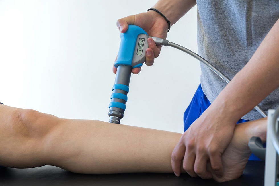 Shockwave therapy treatment applied to lower leg by a physiotherapist.