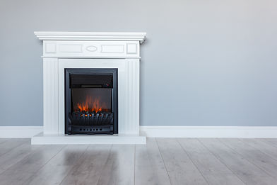 Modern electric fireplace with white mantel in a contemporary living space