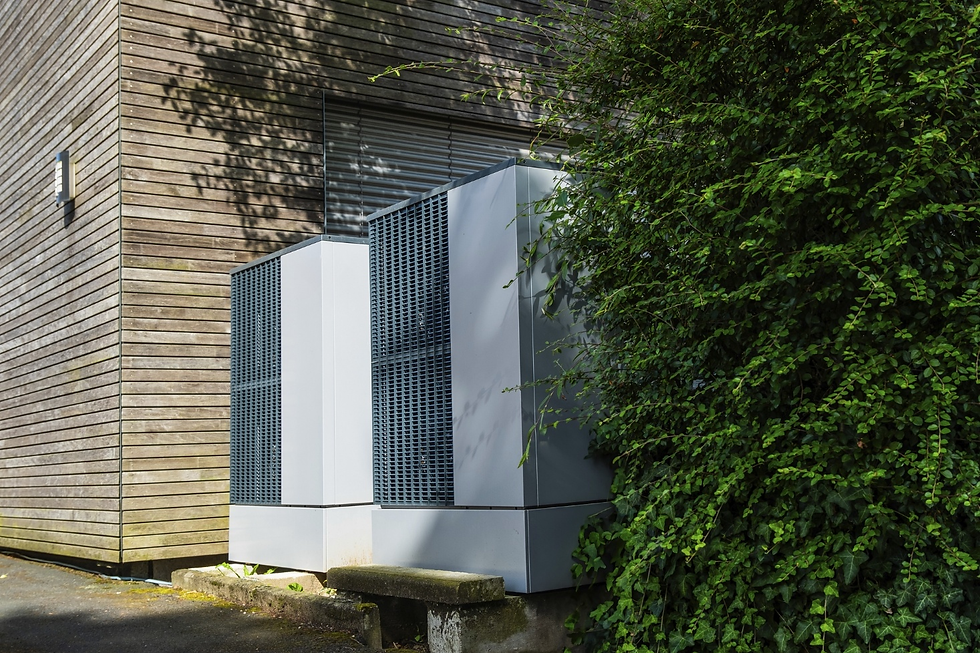 Two heat pumps in the backyard.