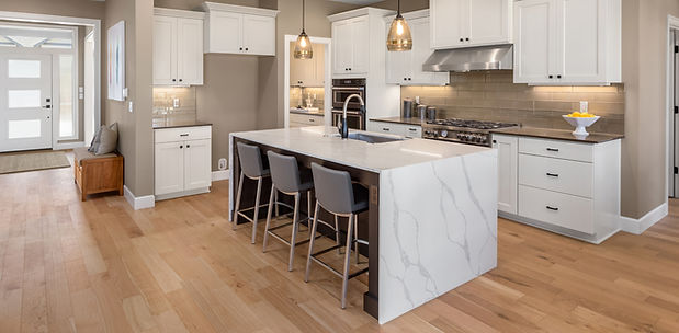 Beautiful kitchen in new luxury home with waterfall island