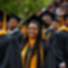african american college students graduating from an HBCU in black and gold caps and gowns