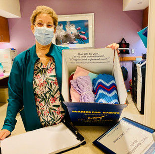 A NICU nurse at the St. Joseph's Women's Hospital in Tampa, FL receiving the beanies.
