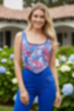 Fashion model wearing colorful floral corset top in Renaissance boho style, styled for summer festival or fairycore aesthetic