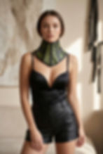 a female model is showcasing Army green and black leather neck corset