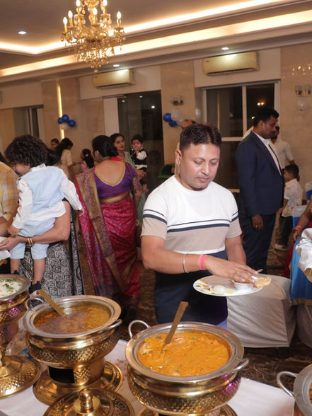 Family and friends at a celebration catered by Patna Caterers