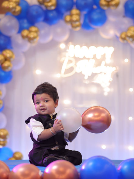 Blue, white and gold balloon arch with neon Happy Birthday sign, first birthday decoration in Greater Noida by Birthday Bazaar