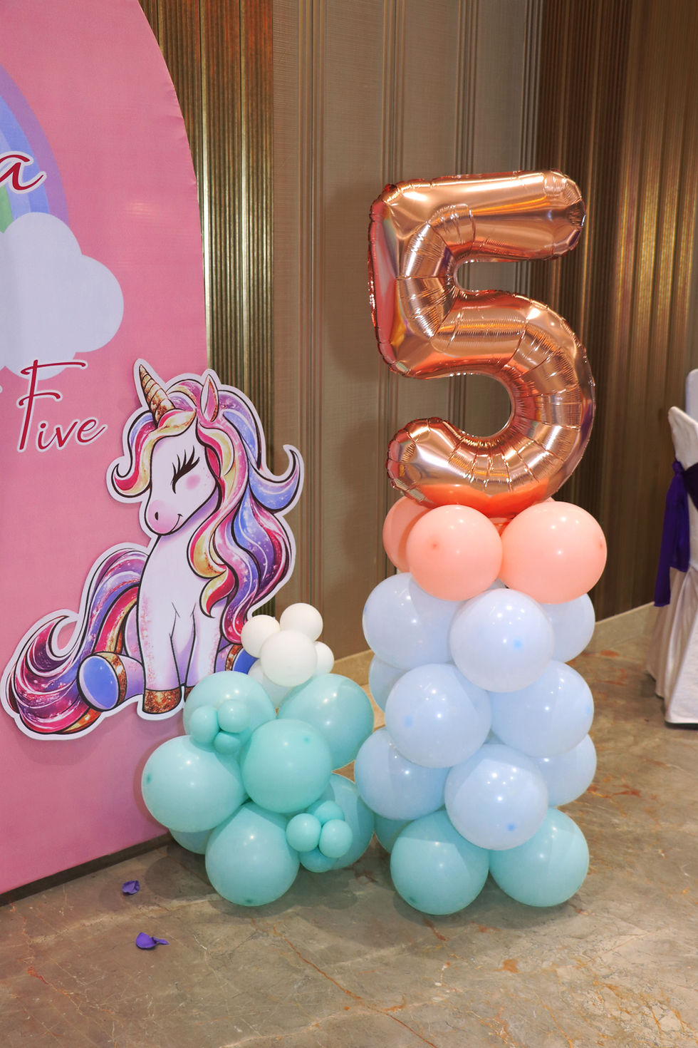 Unicorn cutout with a rose-gold number 5