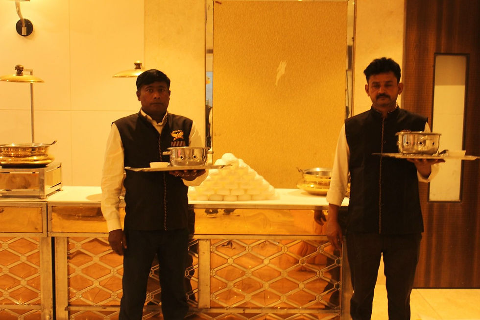Uniformed waiters with serving trays
