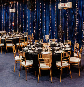 21st birthday decor with fancy oscar themed blue and gold draping and accenting