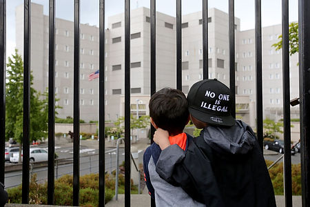 boys looking through bars.jpg
