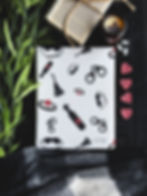 A white book sleeve with different bondage toys in black and red.