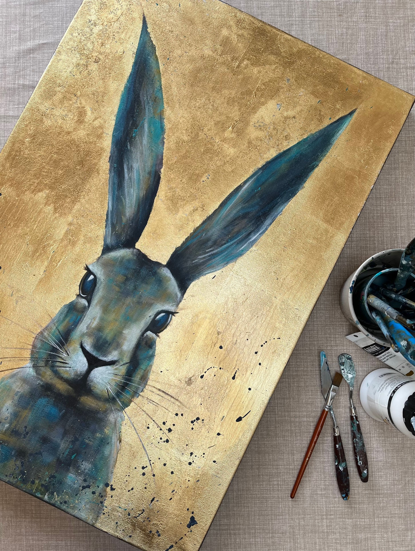 Large hare on gold background